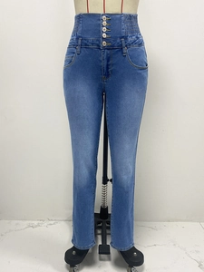 Detailed front view of high-waisted skinny jeans with five-button fly and elastic waistband