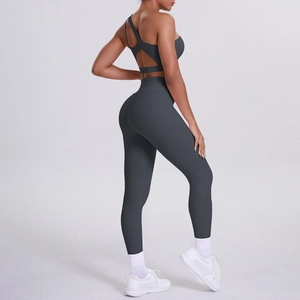 Detail view of charcoal gray cross-back yoga bra and high waist squat proof leggings set