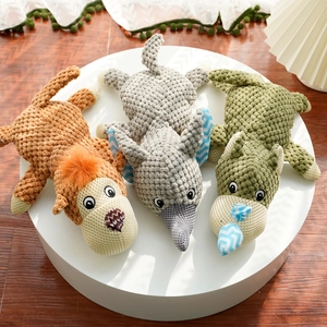 Plush squeaky pet toys featuring lion, elephant and hippo shapes on a white platform