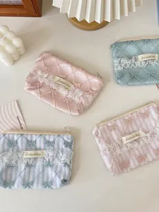Floral lace coin purses in pastel pink and blue with bow embroidery in Zakka style