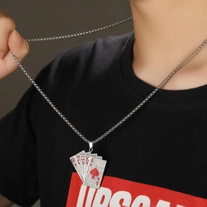 Hip hop silver poker necklace with iced out royal flush pendant on male model