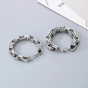 Comparison of thick and thin stainless steel Byzantine chains with secure lobster clasps