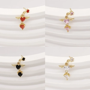 Macro detail of winged heart nose studs in red, pink, black and white color options