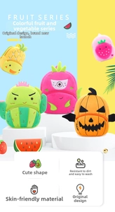 Group shot of colorful plush fruit backpacks for kids in pineapple and strawberry shapes