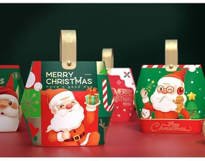 Detail of Christmas gift box with Santa Claus motif and golden carry handle