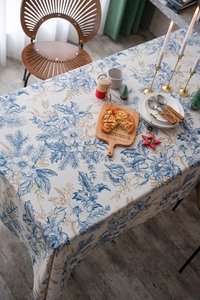 Detail of blue pine needle print tablecloth with rustic American floral patterns