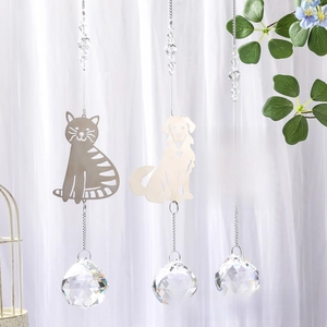 Three animal paw print suncatchers with faceted crystal balls and metallic charms