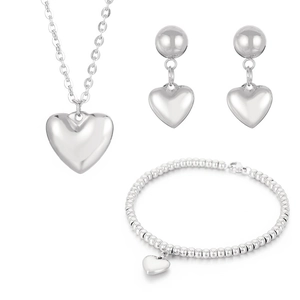 Polished stainless steel jewelry set featuring heart pendants, necklace, bracelet and earrings