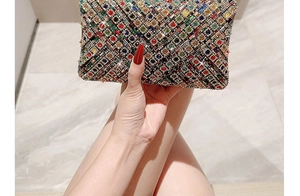 Detailed close-up of a luxury rectangular evening clutch with multi-colored crystals