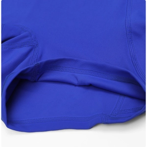 Detail shot of flatlock stitching on royal blue high-waisted yoga shorts fabric