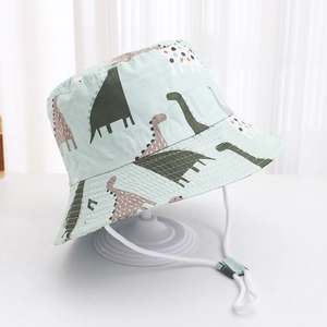Close-up of kids dinosaur bucket hat with adjustable chin strap and soft cotton fabric