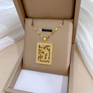 Golden dragon necklace with crystal frame pendant on white silk in beige display box