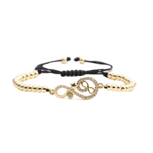 Gold infinity star charm bracelet with black adjustable cord and sparkling zircons