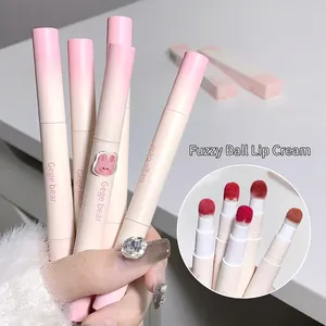 Matte finish lip mud cream with sponge applicator in pink to beige gradient tube