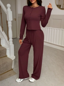 Deep red two-piece set featuring long sleeve cardigan and wide-leg trousers in soft fabric