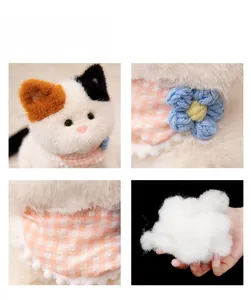 Detail of calico cat plush toy with pink scarf showing soft white PP cotton stuffing