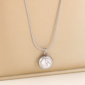 Minimalist silver titanium necklace featuring a round crystal pendant on a sleek snake chain
