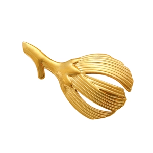 Detail of golden plant petal brooch featuring polished radial stripe texture and metallic finish