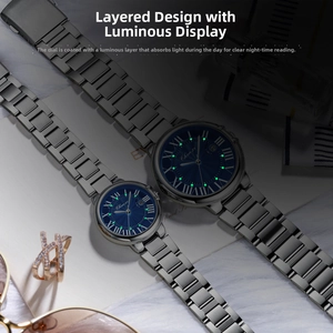 Luminous green glow on watch hands and Roman numerals shown in low light environment