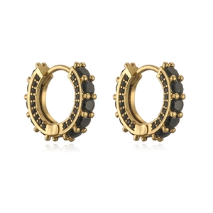 Detailed macro view of gold hoops with double rows of black rhinestones on white base