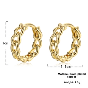 Detail of gold plated copper huggie hoop earrings with classic chain link texture
