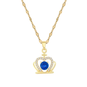 Gold crown pendant necklace with blue gemstone and zircon crystals on white background