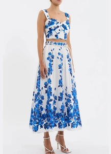 Detail of floral crop top and high-waisted maxi skirt set with waist tie decoration
