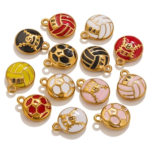 Detailed macro view of colorful enamel sports ball pendants in volleyball and soccer shapes