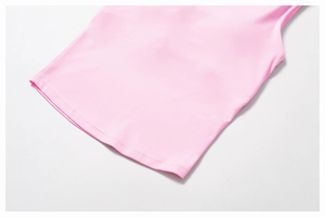 Detail of the pink yoga vest hem showing high-quality stitching and soft knit fabric texture
