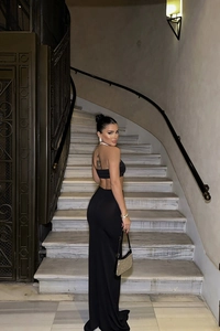 Elegant black two-piece evening set featuring a backless top and side slit maxi skirt