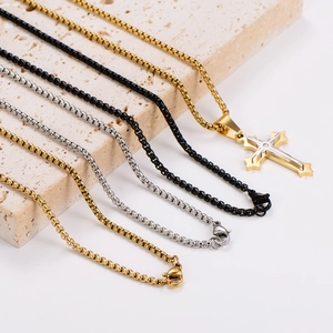 Punk style stainless steel necklaces with tiered cross pendants in gold, silver and black