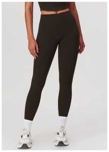 Detailed shot of high-waisted dark coffee yoga pants with slimming V-waistband