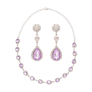 Elegant silver-tone jewelry set featuring purple teardrop gems and crystal necklace