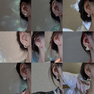 Variety of S925 silver needle zircon and pearl earrings set shown on model ear