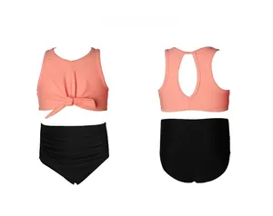 Detailed flat lay of coral orange tie-front top and high-waisted black bikini bottom set