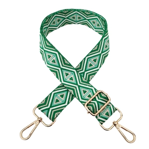 Detail of green and white diamond pattern woven wide strap with gold swivel hooks