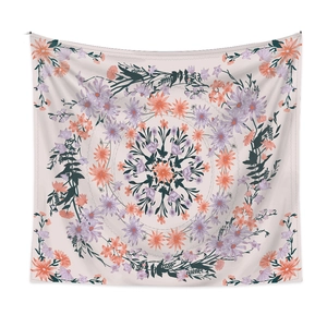 Close-up of mandala floral tapestry featuring symmetrical patterns in lilac and orange