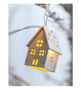 Close-up of wooden house-shaped LED pendant light with warm glow for Christmas decor