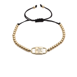 Bracelet ajustable en corde noire avec perles dorées et breloque étoile sertie de zircons
