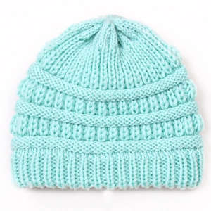 Close-up of thick ribbed knit texture on soft pastel blue winter beanie for infants