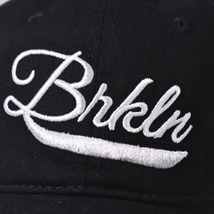 Cotton baseball cap with white Brkln embroidery and detailed textured finish