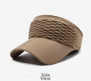 Close-up of brown knitted sun visor showing textured ribbed weave and wide curved brim