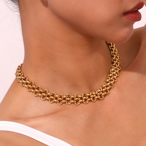 Close-up of 18K gold-plated stainless steel chunky triple-layered chain necklace on neck