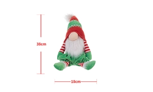 Detail of a 38cm Christmas gnome plush featuring red and white striped knit hat and faux fur