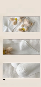 Detail view of white socks showing elastic cuffs, reinforced heels and flat toe seams