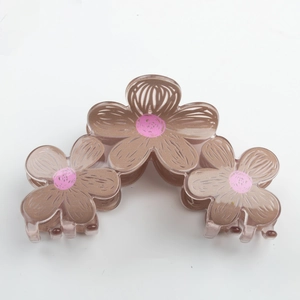 Cute brown candy-colored floral hair claw clip with pink accents for women hairstyle