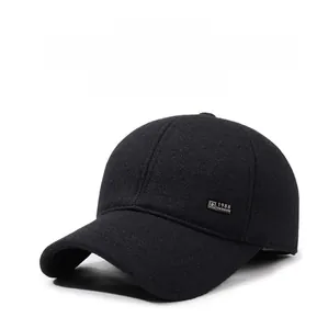 Detail view of winter baseball cap earflaps and 1988 FASHION metal badge detail