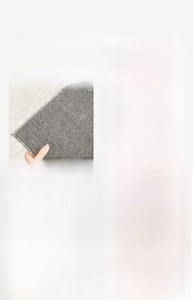 Detail of waterproof linen carpet showing handmade edge stitching and anti-slip backing