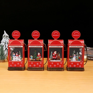 Set of four red vintage gas station Christmas lanterns with miniature festive scenes