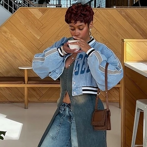 Short denim jacket in blue wash with striped ribbed collar and cuffs in cafe setting